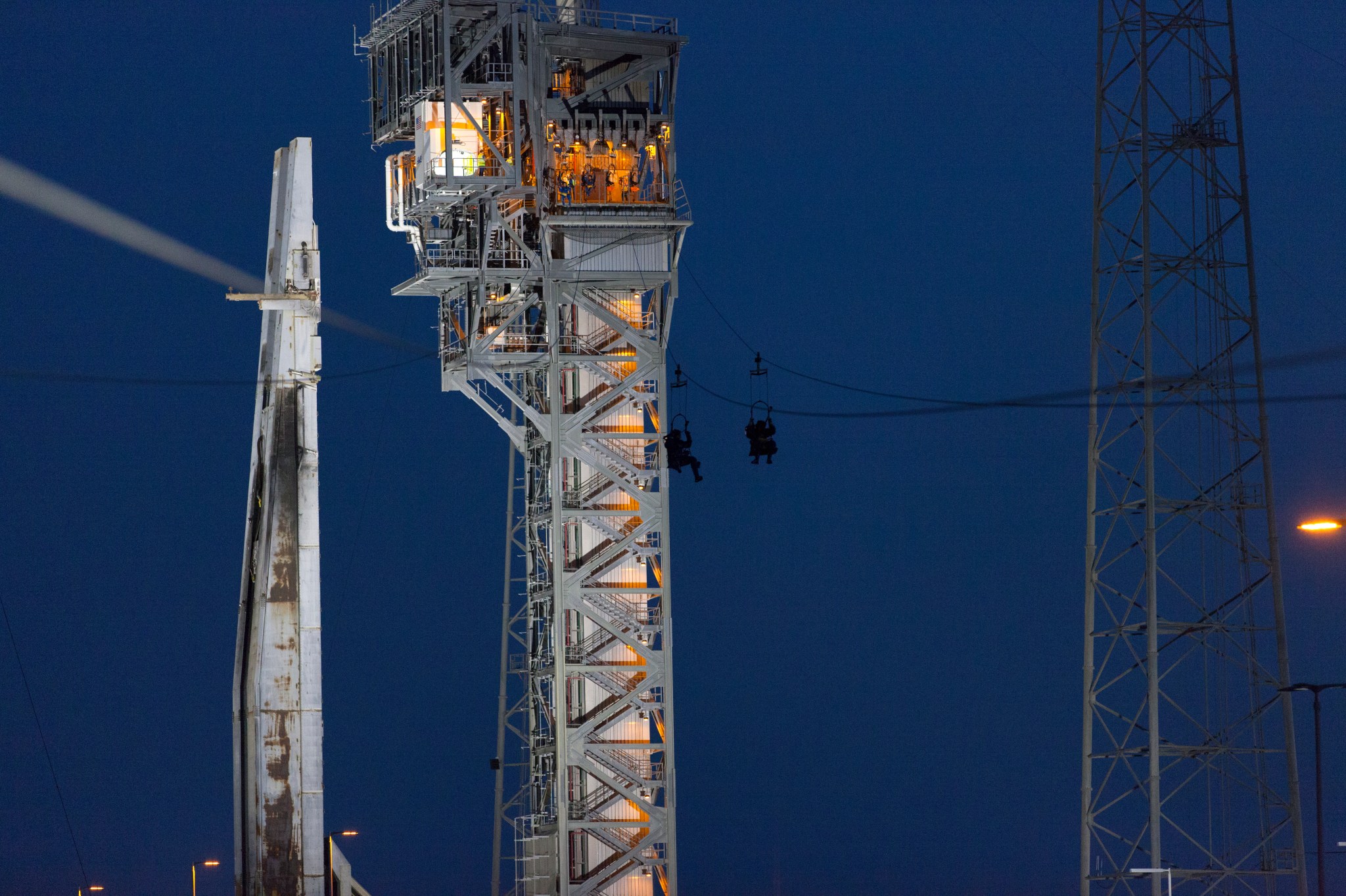 Commercial Crew astronauts participate in a Boeing/United Launch Alliance (ULA) emergency egress system demonstration at Cape Canaveral Air Force Station’s Launch Complex 41.