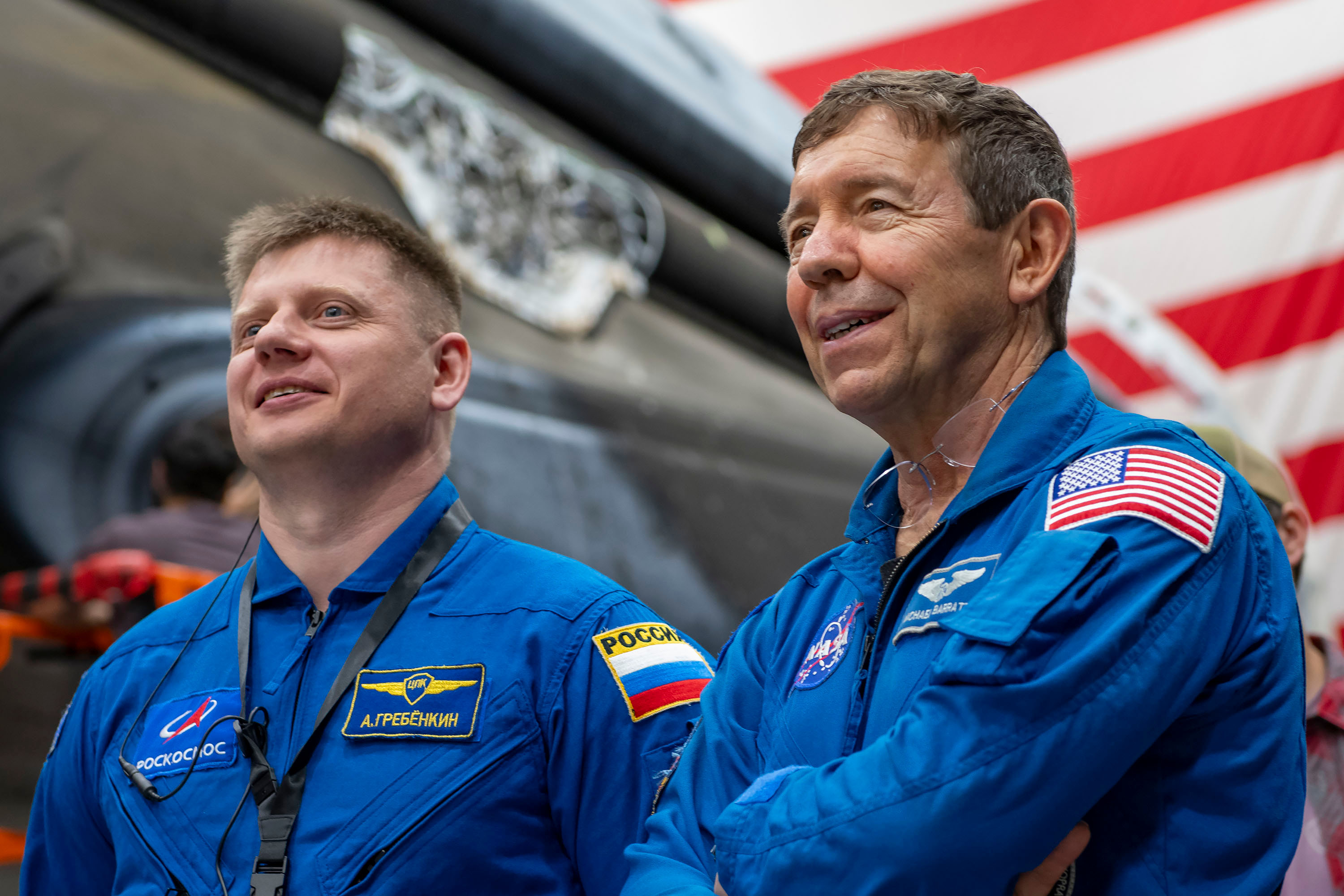 SpaceX Crew-9 crew members Alexander Grebenkin and Michael Barratt, Mission Specialist and Pilot, respectively, are pictured inside SpaceX Hangar X at the Kennedy Space Center in Florida. Hangar X supports Falcon 9 rocket refurbishment and houses administration offices.