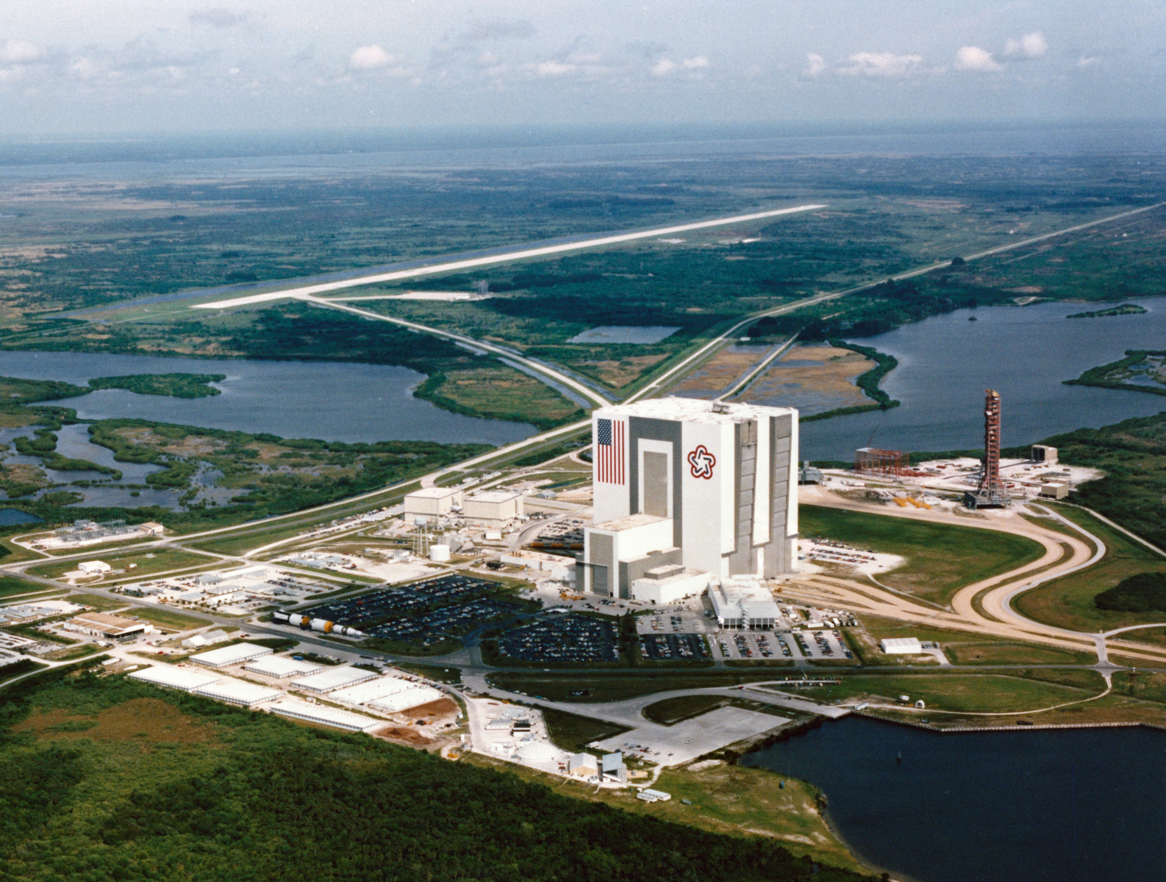 Aerial view at NASA's Kennedy Space Center (KSC) in Florida of the Vehicle Assembly Building (VAB) and the Shuttle Landing Facility, where STS-41B made the first landing of the program