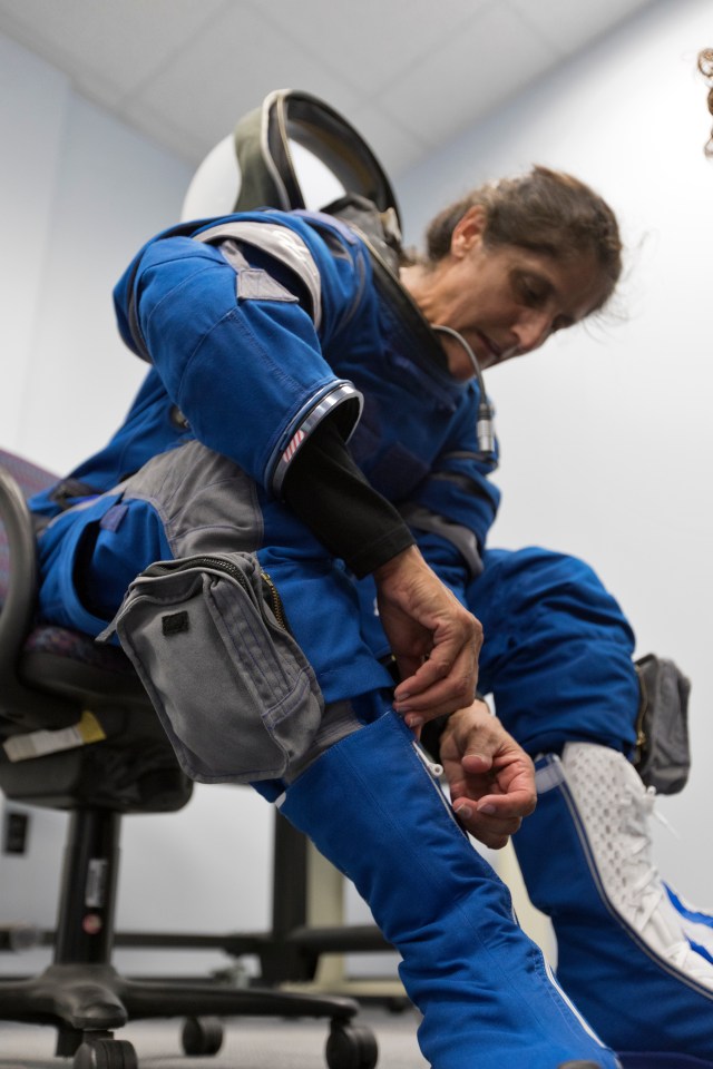 Astronaut Suni Williams gets suited up in preparation for the Boeing/United Launch Alliance emergency egress system demonstration.