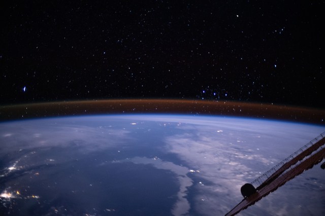 iss062e081621 (March 4, 2020) --- The amber hue hovering just above the Earth's limb is the atmospheric glow with the Milky Way's stars sparkling in the background. This long-duration photograph was taken from the International Space Station at an altitude of 262 miles above Kazakhstan.