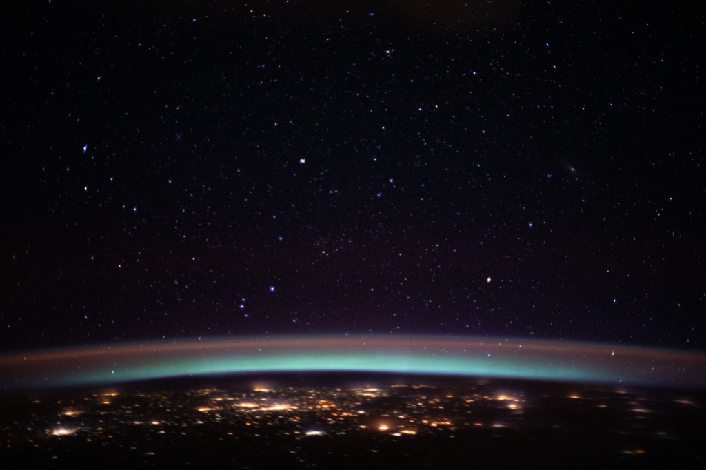 iss062e103874 (March 20, 2020) --- The city lights at the intersection of Europe and Asia sparkle underneath an atmospheric glow and a starry night sky as the International Space Station orbited 262 miles above into an orbital sunset.