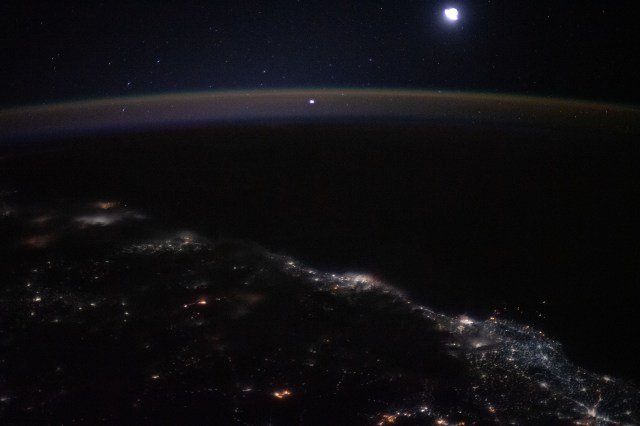 iss062e104017 (March 20, 2020) --- The city lights of Mumbai to Goa (from bottom left to center right) highlight India's coast on the Arabian Sea as the International Space Station orbited 261 miles above.