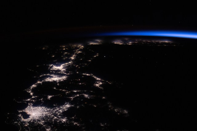 iss062e098243 (March 16, 2020) --- The city lights of Japan, with Tokyo at bottom, seemingly trail off onto into an orbital sunrise as the International Space Station orbited 260 miles above the Pacific Ocean.