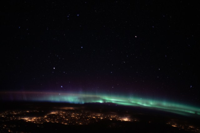 iss062e113596 (March 22, 2020) --- The city lights of northeastern Europe sparkle beneath an aurora and a starry sky as the International Space Station orbited 263 miles above Hungary.