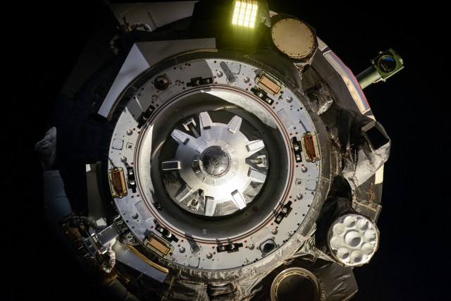 iss063e000001 (April 17, 2020) --- The docking module of the Soyuz MS-15 crew ship is pictured moments after undocking from the Zvezda service module with the Expedition 62 crewmembers, Oleg Skripochka, Jessica Meir and Andrew Morgan, onboard. They would parachute to a landing on Earth less than three-and-a-half hours later inside the Soyuz descent module.