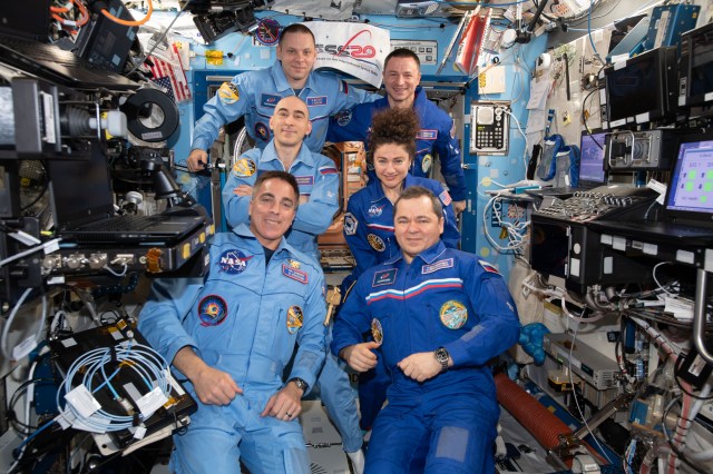 iss062e150159 (March 15, 2020) --- The Expedition 62 and 63 crews pose together moments after Roscosmos cosmonaut Oleg Skripochka (bottom right) handed over station command to NASA astronaut Chris Cassidy (bottom left). On the right side, are Expedition 62 crewmembers Skripochka with NASA astronauts Jessica Meir and Andrew Morgan. On the left, are Expedition 63 crewmembers Cassidy with Roscosmos cosmonauts Anatoly Ivanishin and Ivan Vagner. The Expedition 62 crew returned to Earth on April 17, 2020, at 1:16 a.m. EDT (11:16 a.m. Kazakh time).