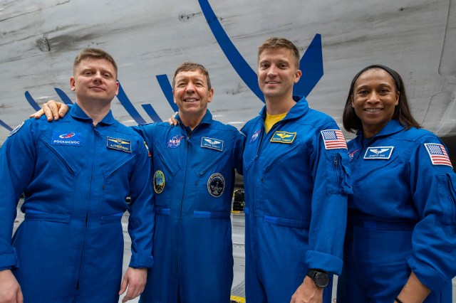 The four crew members that comprise the SpaceX Crew-8 mission pose for a photo inside SpaceX Hangar X at the Kennedy Space Center in Florida. Hangar X supports Falcon 9 rocket refurbishment and houses administration offices. From left are, Mission Specialist Alexander Grebenkin, Pilot Michael Barratt, Commander Matthew Dominick, and Mission Specialist Jeanette Epps.