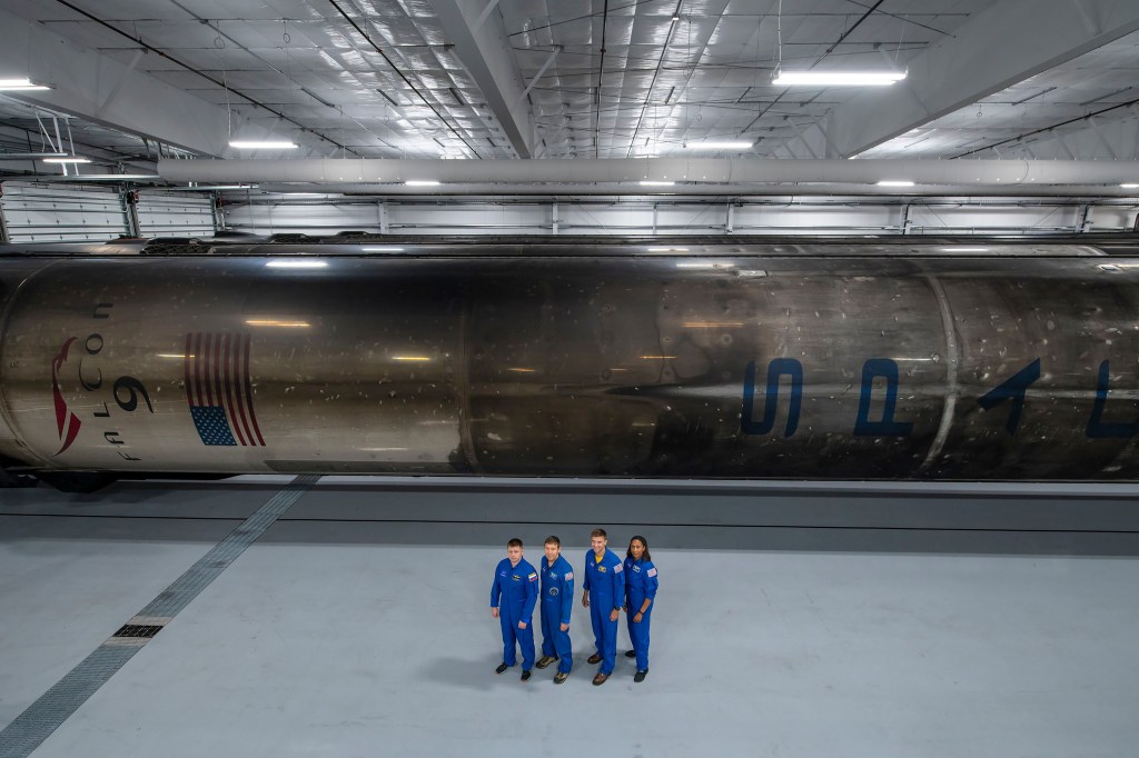 The four crew members that comprise the SpaceX Crew-8 mission pose for a photo inside SpaceX Hangar X at the Kennedy Space Center in Florida. Hangar X supports Falcon 9 rocket refurbishment and houses administration offices. From left are, Mission Specialist Alexander Grebenkin, Pilot Michael Barratt, Commander Matthew Dominick, and Mission Specialist Jeanette Epps.