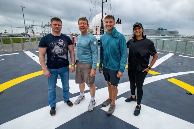 The four crew members that comprise the SpaceX Crew-8 mission pose for a photo on the SpaceX helipad at the Kennedy Space Center in Florida. From left are, Mission Specialist Alexander Grebenkin, Pilot Michael Barratt, Commander Matthew Dominick, and Mission Specialist Jeanette Epps.