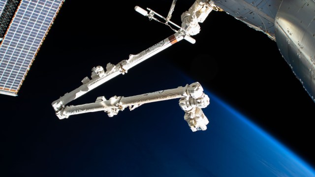 iss062e055099 (Feb. 25, 2020) --- The International Space Station's 57.7-foot-long robotic arm, also known as the Canadarm2, is pictured attached to the Harmony module as the orbital complex flies into an orbital sunrise above the Pacific Ocean.