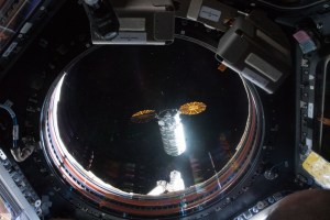 This view taken from inside the Cupola shows the Orbital ATK space freighter approaching its capture point about 10 meters from the International Space Station where it was grappled with the Canadarm2 robotic arm.