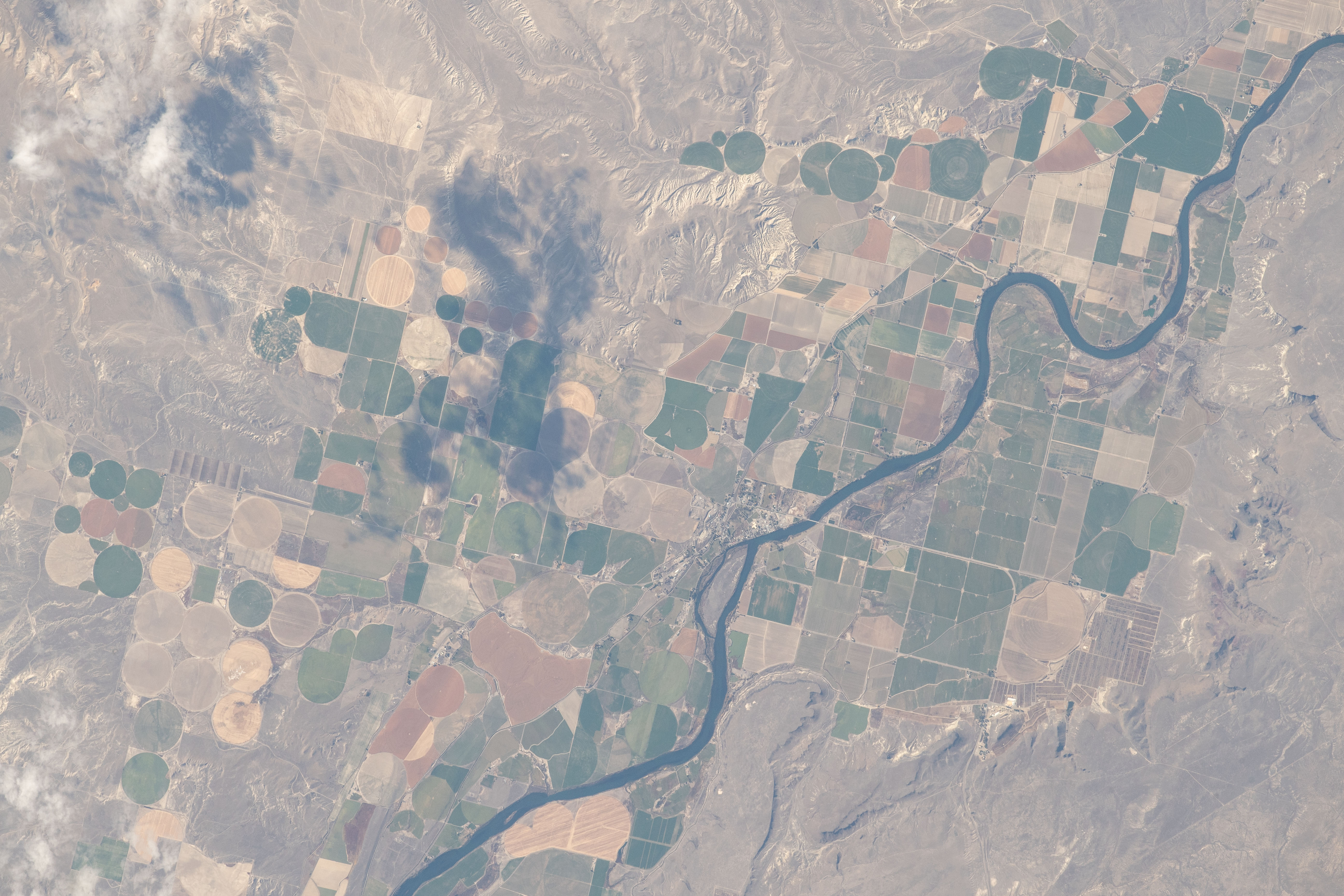 The rural community of Grand View, Idaho is just south of the Ted Trueblood Wildlife Area which can host a variety of thousands of birds during migration periods. Snake River flows through the area and also forms portions of the Idaho, Oregon and Washington borders. The International Space Station was orbiting 256 miles above North America when this photograph was taken.