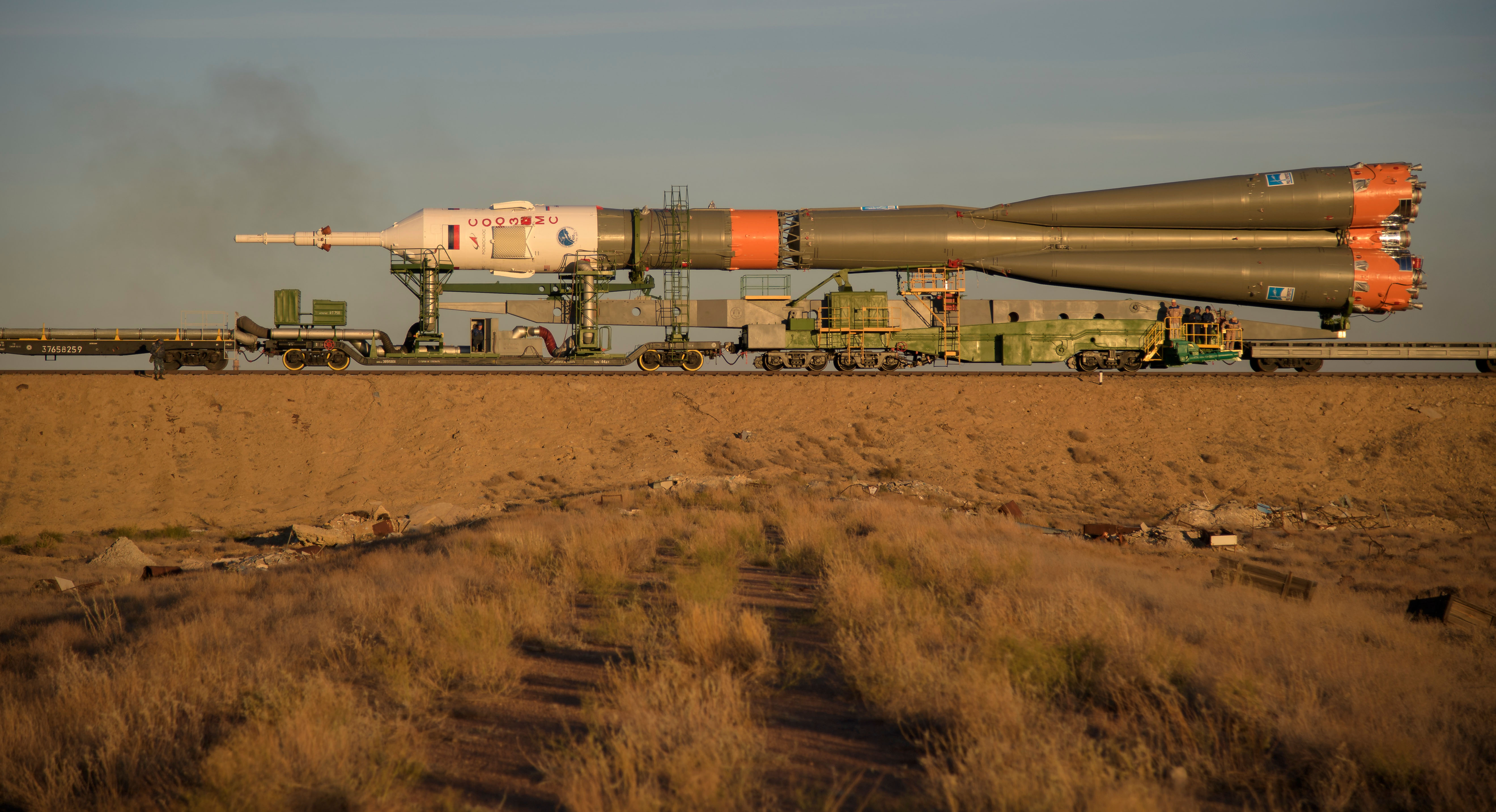 The Soyuz rocket is rolled out by train to the launch pad, Tuesday, Oct. 9, 2018 at the Baikonur Cosmodrome in Kazakhstan. Expedition 57 crewmembers Nick Hague of NASA and Alexey Ovchinin of Roscosmos are scheduled to launch on October 11 and will spend the next six months living and working aboard the International Space Station.