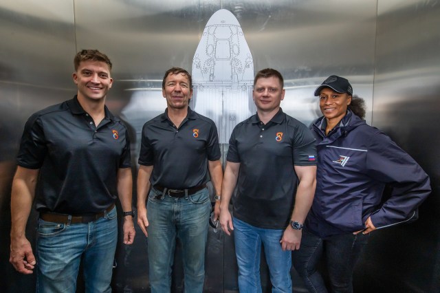 (Left to right) NASA Astronauts Matthew Dominick, Michael Barratt, Roscosmos Cosmonaut Alexander Grebenkin, and NASA Astronaut Jeanette Epps pose for a photo during their Crew Equipment Interface Test at NASA’s Kennedy Space Center in Florida. The goal of the training is to rehearse launch day activities and get a close look at the spacecraft that will take them to the International Space Station.