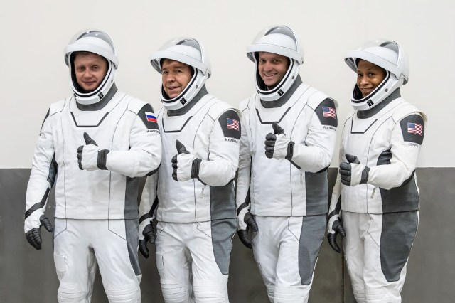(Left to right) Roscosmos cosmonaut Alexander Grebenkin and NASA astronauts Michael Barratt, Matthew Dominick, and Jeanette Epps pose for a photo during their Crew Equipment Interface Test at NASA’s Kennedy Space Center in Florida. The goal of the training is to rehearse launch day activities and get a close look at the spacecraft.