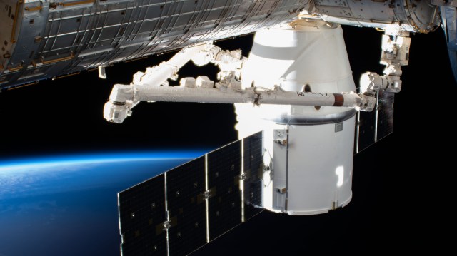 iss056e075978 (July 3, 2018) --- The SpaceX Dragon resupply ship, on its 15th Commercial Resupply Services mission (CRS-15) for NASA, is pictured attached to the International Space Station the day after it was captured and installed on the Harmony module. The orbital complex was flying over northern central China near the Mongolian border at the time this photograph was taken.