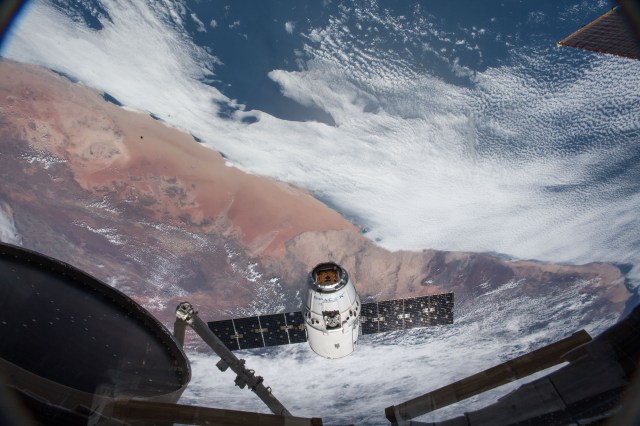 The SpaceX Dragon resupply ship approaches the International Space Station before its capture as both spacecraft begin an orbital pass off the southern coast of Namibia then northwest across the continent of Africa.