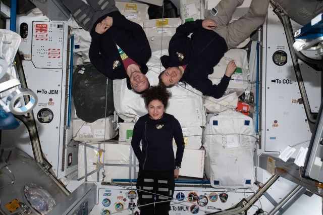 iss062e069045 (Feb. 28, 2020) --- The three-member Expedition 62 crew poses for a portrait inside the Harmony module. Harmony is connected to three International Space Station laboratory modules -- Europe's Columbus, Japan's Kibo and the United States' Destiny lab modules. Clockwise from bottom are, NASA astronauts Jessica Meir and Andrew Morgan and Roscosmos cosmonaut Oleg Skripochka.
