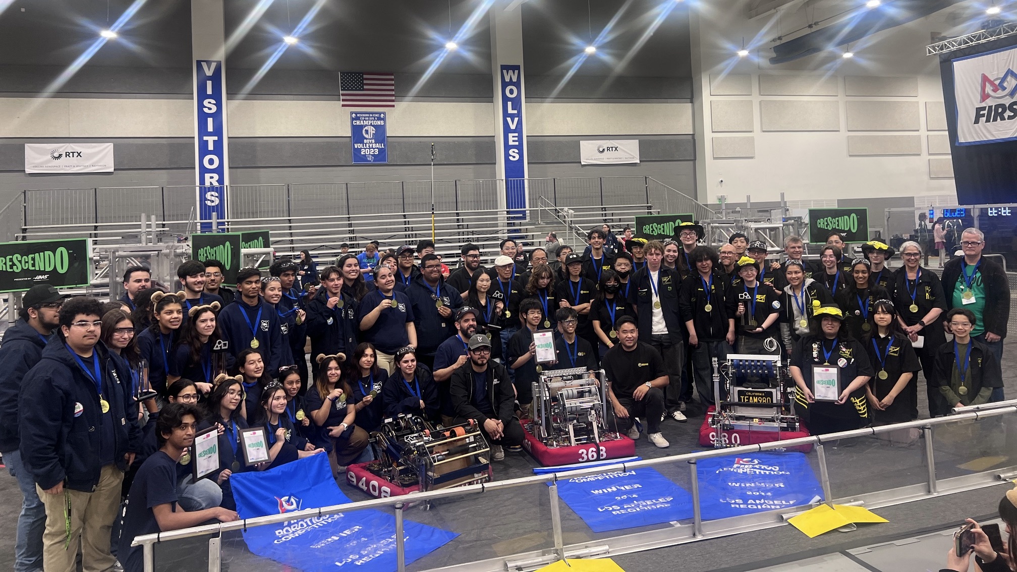 The winning alliance poses at the Los Angeles regional FIRST Robotics Competition on March 17.