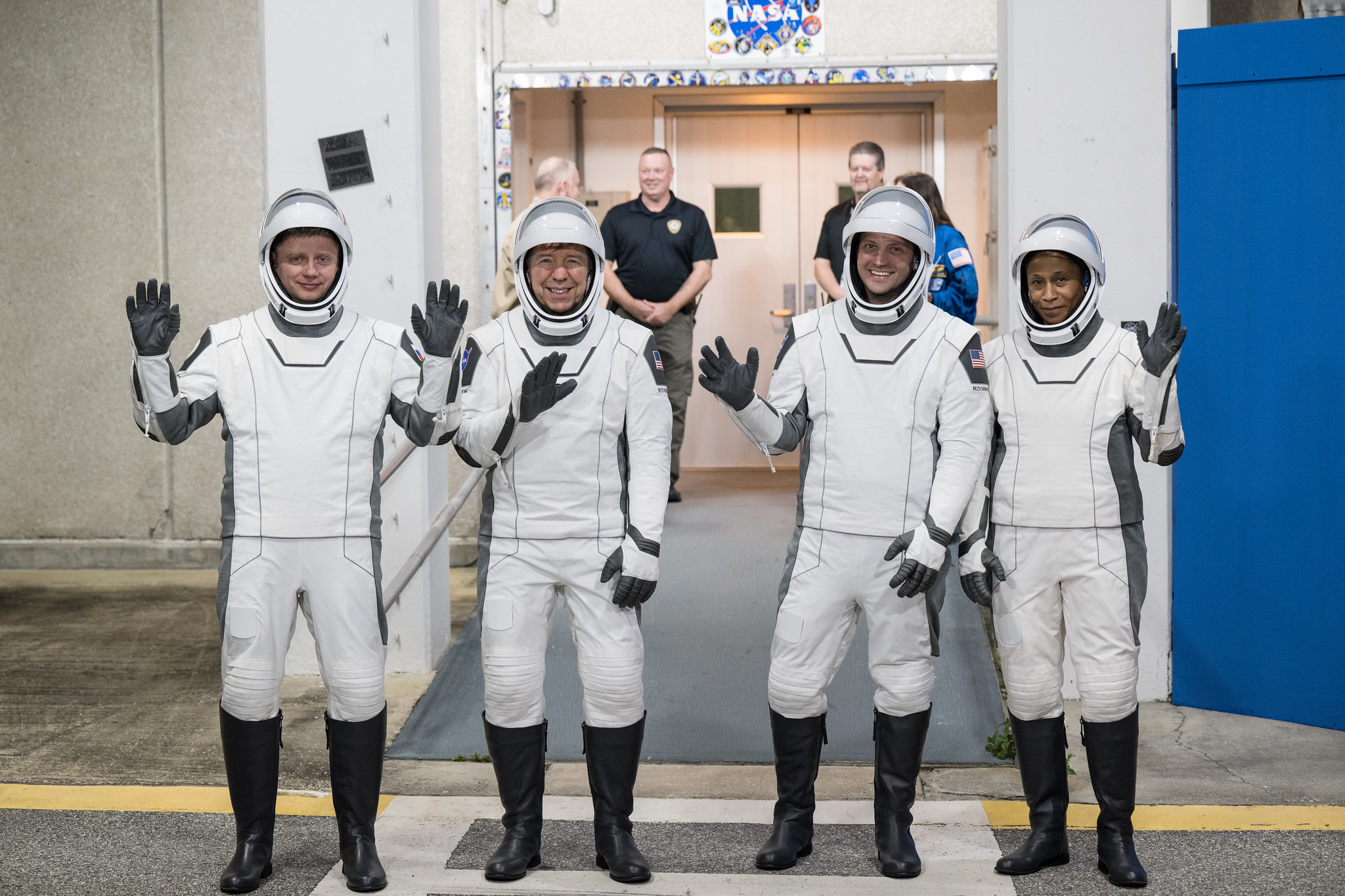 From left to right, Roscosmos cosmonaut Alexander Grebenkin, and NASA astronauts Michael Barratt, Matthew Dominick, and Jeanette Epps, wearing SpaceX spacesuits, are seen as they prepare to depart the Neil A. Armstrong Operations and Checkout Building for Launch Complex 39A during a dress rehearsal prior to the Crew-8 mission launch, Monday, Feb. 26, 2024, at NASA’s Kennedy Space Center in Florida.