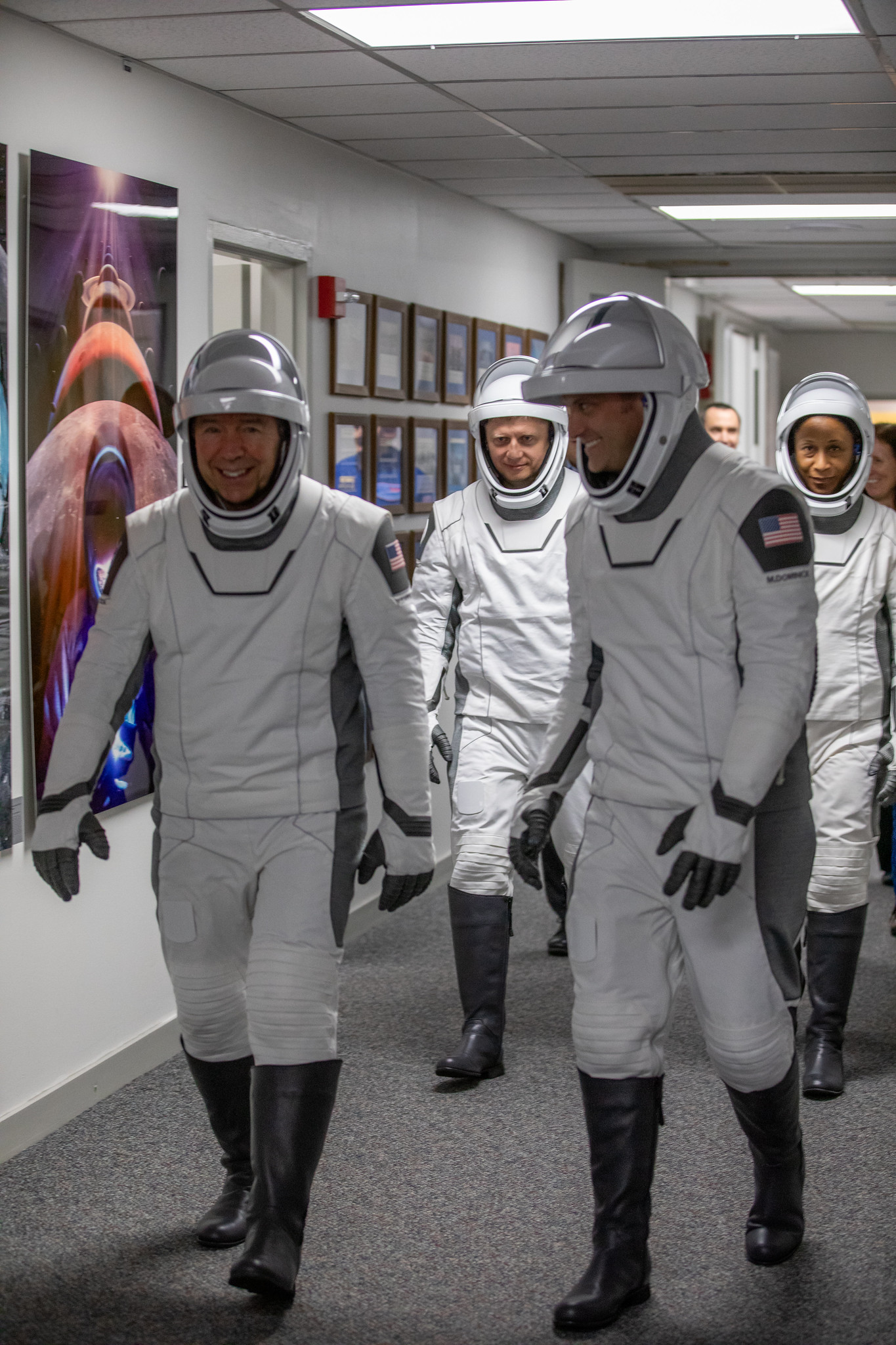 NASA's SpaceX Crew-8 crew members walk out of the Neil A. Armstrong Operations and Checkout Building on March 3 at the agency's Kennedy Space Center. From left to right, NASA astronaut Michael Barratt, Roscosmos cosmonaut Alexander Grebenkin, and NASA astronauts Matthew Dominick and Jeanette Epps make their way to waiting vehicles for the trip to Kennedy's Launch Complex 39A. They later launched from the complex to the International Space Station aboard SpaceX's Dragon spacecraft atop the Falcon 9 rocket.