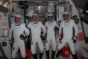 iss070e108279 (March 6, 2024) --- Four Expedition 70 crewmates pose in the pressure suits they will wear when they return to Earth aboard the SpaceX Dragon "Endurance" spacecraft. From left are, Roscosmos cosmonaut Konstantin Borisov, ESA (European Space Agency) astronaut Andreas Mohgensen, NASA astronaut Jasmin Moghbeli, and JAXA (Japan Aerospace Exploration Agency) astronaut Satoshi Furukawa. The quartet arrived at the International Space Station on Aug. 27, 2023, as SpaceX Crew-7 members aboard Dragon and will splash down off the coast of Florida inside the same spacecraft completing a six-and-a-half-month space research mission.