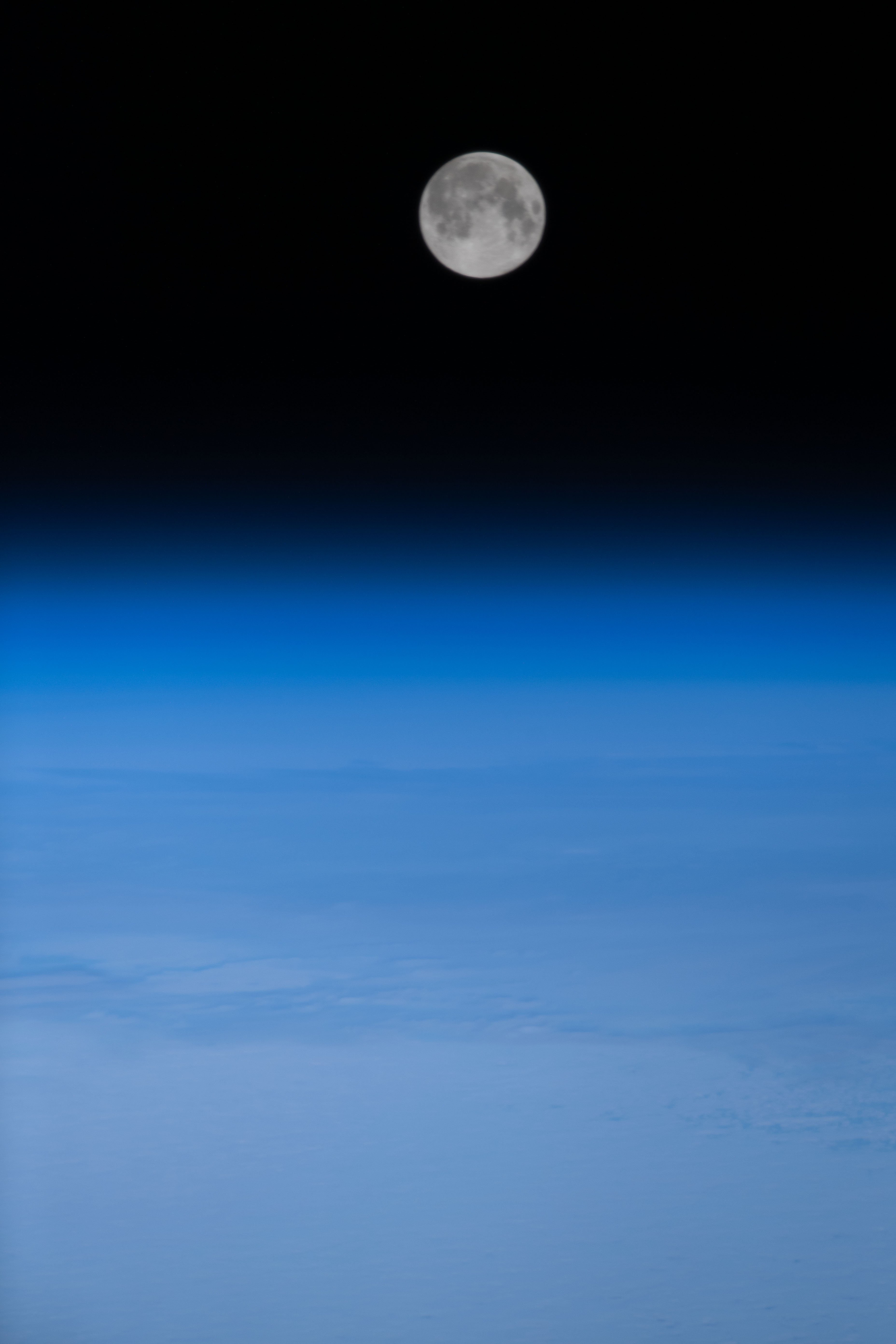iss070e108461 (Feb. 24, 2024) -- February's full moon, the Snow Moon, rises above Earth's blue horizon as the International Space Station soared 261 miles above the Atlantic Ocean.