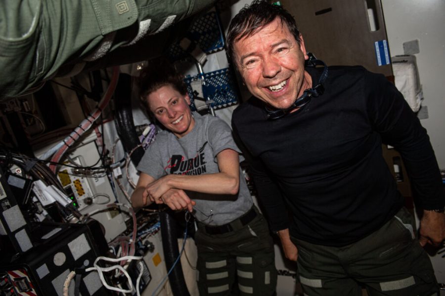 Expedition 70 Flight Engineers and NASA astronauts Loral O'Hara and Michael Barratt post for a portrait together aboard the International Space Station.