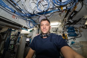 iss070e108718 (March 6, 2024) -- Expedition 70 Flight Engineer and NASA astronaut Matthew Dominick poses for a selfie while testing out a camera aboard the International Space Station.