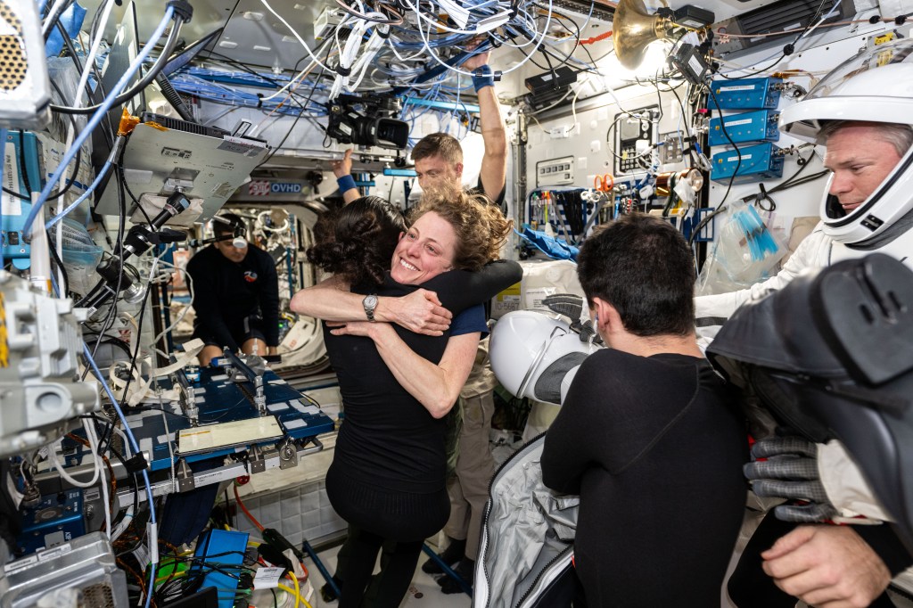 iss070e113242 (March 11, 2024) -- NASA astronauts Loral O'Hara and Jasmin Moghbeli hug ahead of Crew-7's departure from the International Space Station. NASA's SpaceX Crew-7 departed the space station on Monday, March 11 before splashing down off the coast of Florida on Tuesday, March 12.