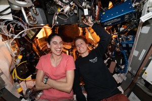 iss070e111242 (March 10, 2024) -- NASA astronauts Jasmin Moghbeli and Loral O'Hara are pictured inside the International Space Station's cupola