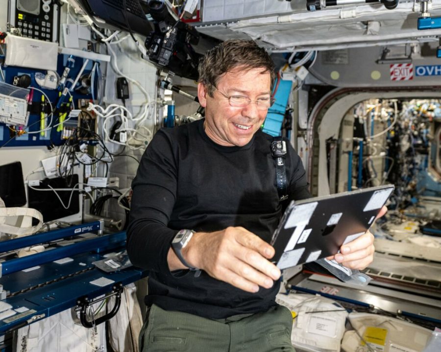 NASA astronaut and Expedition 70 Flight Engineer Michael Barratt uses an iPad to review the on-orbit schedule for residents aboard the International Space Station.