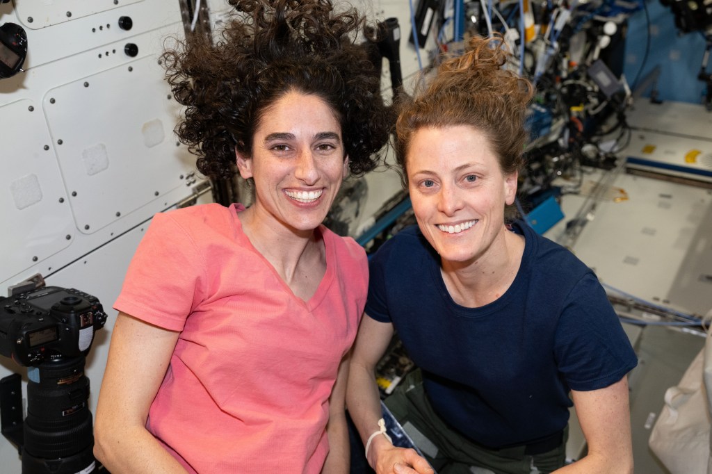 iss070e110924 (March 8, 2024) -- NASA astronauts and Expedition 70 Flight Engineers Jasmin Moghbeli and Loral O'Hara pose for a portrait aboard the International Space Station.