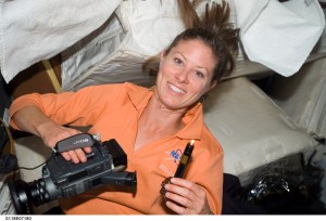 Astronaut Tracy Dyson poses for a photo on the middeck of Space Shuttle Endeavour while docked with the International Space Station during STS-118. Credit: NASA