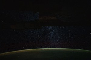 iss060e002062 (June 29, 2019) --- A starry nighttime background seemingly glitters down on Earth's atmospheric glow as the International Space Station orbited 266 miles above Auckland, New Zealand.
