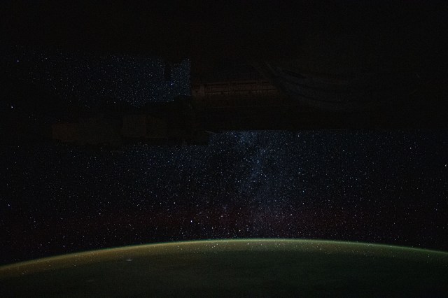 iss060e002062 (June 29, 2019) --- A starry nighttime background seemingly glitters down on Earth's atmospheric glow as the International Space Station orbited 266 miles above Auckland, New Zealand.