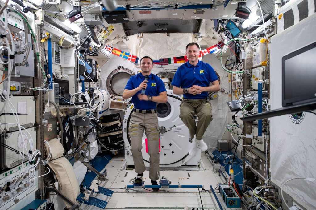 iss060e054187 -- Expedition 60 flight engineers Andrew Morgan and Nick Hague of NASA conduct in-flight interviews on Sept. 5 with television stations located in Pittsburgh, PA where they discuss what it's like living and working on the International Space Station.
