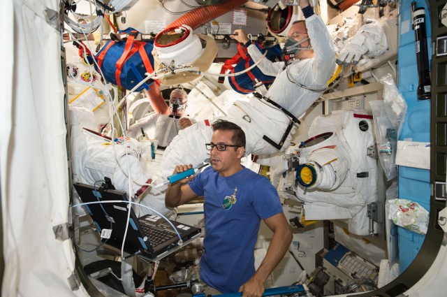 Astronaut Joe Acaba (foreground) assisted crewmates Randy Bresnik (right) and Mark Vande Hei before they began a spacewalk on Oct. 10. Bresnik and Vande Hei were performing the In-Suit Light Exercise protocol where the astronauts perform light exercise and pre-breathe pure oxygen before beginning a spacewalk. The technique helps purge nitrogen bubbles from their bodies to prevent them from experiencing “the bends” at the lower pressure inside the space suit.
