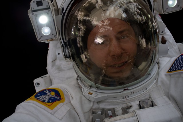 iss060e043180 (Aug. 21, 2019) --- NASA astronaut Nick Hague takes an out-of-this-world "space-selfie" during a spacewalk to install the International Space Station’s second commercial crew vehicle docking port, the International Docking Adapter-3 (IDA-3).