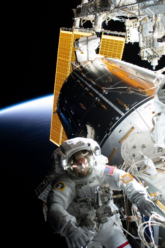 iss060e043273 (Aug. 21, 2019) --- NASA astronaut Nick Hague is pictured tethered to the forward end of the International Space Station during a spacewalk to install the orbiting lab's second commercial crew vehicle docking port, the International Docking Adapter-3 (IDA-3).