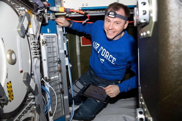 iss060e073271 (Sept. 18, 2019) --- Expedition 60 Flight Engineer Nick Hague of NASA works inside the U.S. Destiny laboratory module conducting maintenance on science hardware aboard the International Space Station.