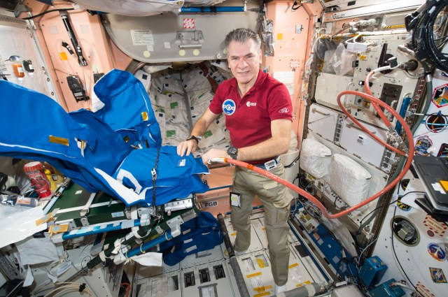 Expedition 53 Flight Engineer Paolo Nespoli, from the European Space Agency, fills a personal radiation shielding garment with water. Water is used for its shielding properties and filled inside garment containers covering organs that are especially sensitive to cosmic radiation.