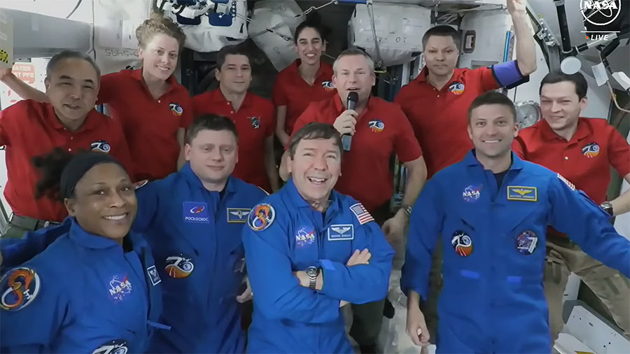 The four SpaceX Crew-8 members (front row) join the Expedition 70 crew (back row) for welcome remarks shortly after docking and entering the space station. Credit: NASA TV