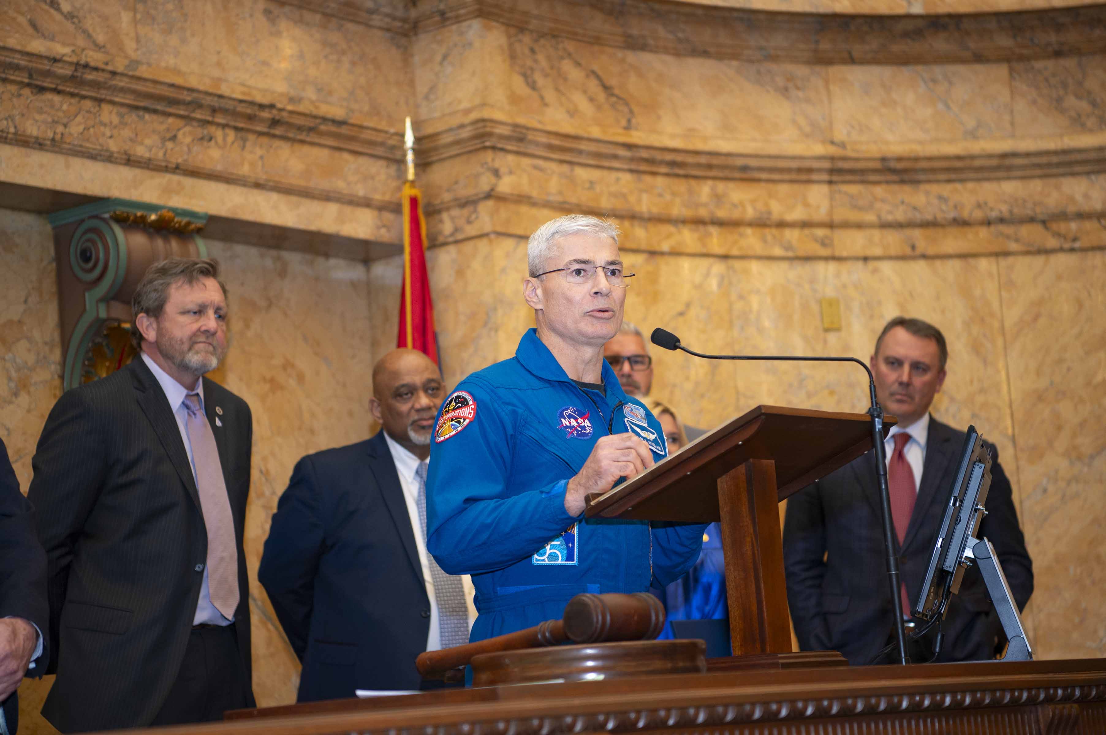NASA astronaut Mark Vande Hei speaks with Mississippi legislators during Stennis Day at the Capitol