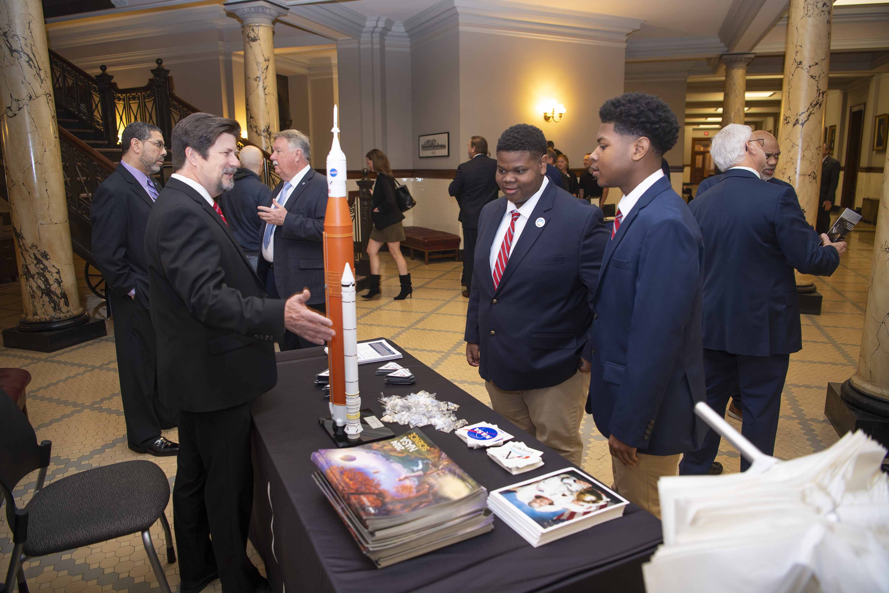 NASA Stennis Safety and Mission Assurance Director Gary Benton speaks with students serving as legislative pages