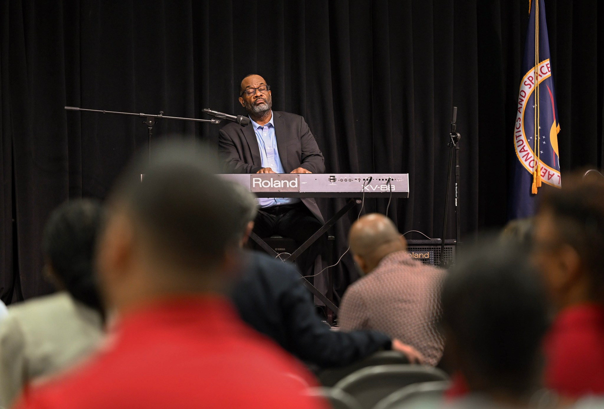 Kim Jones, a systems engineer at Marshall, plays “Trouble of the World” during the Black History Month observance.