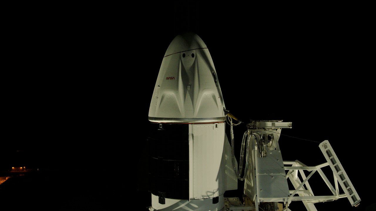 A SpaceX Falcon 9 rocket with the company’s Dragon spacecraft on top is seen on the launch pad at Launch Complex 39A at Kennedy Space Center.