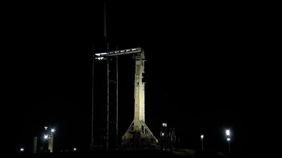 A SpaceX Falcon 9 rocket with the company’s Dragon spacecraft on top is seen on the launch pad at Launch Complex 39A at Kennedy Space Center.
