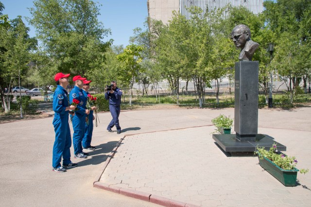 Expedition 52-53 backup crewmembers Norishige Kanai of the Japan Aerospace Exploration Agency (JAXA, left), Alexander Misurkin of the Russian Federal Space Agency (Roscosmos, center) and Mark Vande Hei of NASA (right) pay tribute at the statue of Russian space designer Mikhail Ryazanskiy in the town of Baikonur, Kazakhstan July 18. The statue honors Ryazanskiy, who was the grandfather of prime crewmember Sergey Ryazanskiy of Roscosmos. The three are serving as backups to Ryazanskiy, Randy Bresnik of NASA and Paolo Nespoli of the European Space Agency, who will launch July 28 on the Soyuz MS-05 spacecraft from the Baikonur Cosmodrome for a five-month mission on the International Space Station.